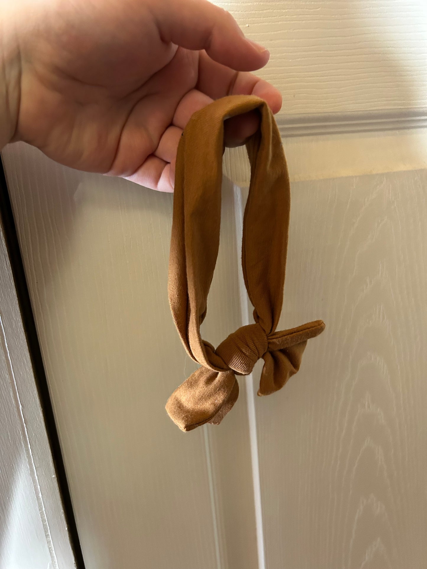 Copper Pearl infant brown bow
