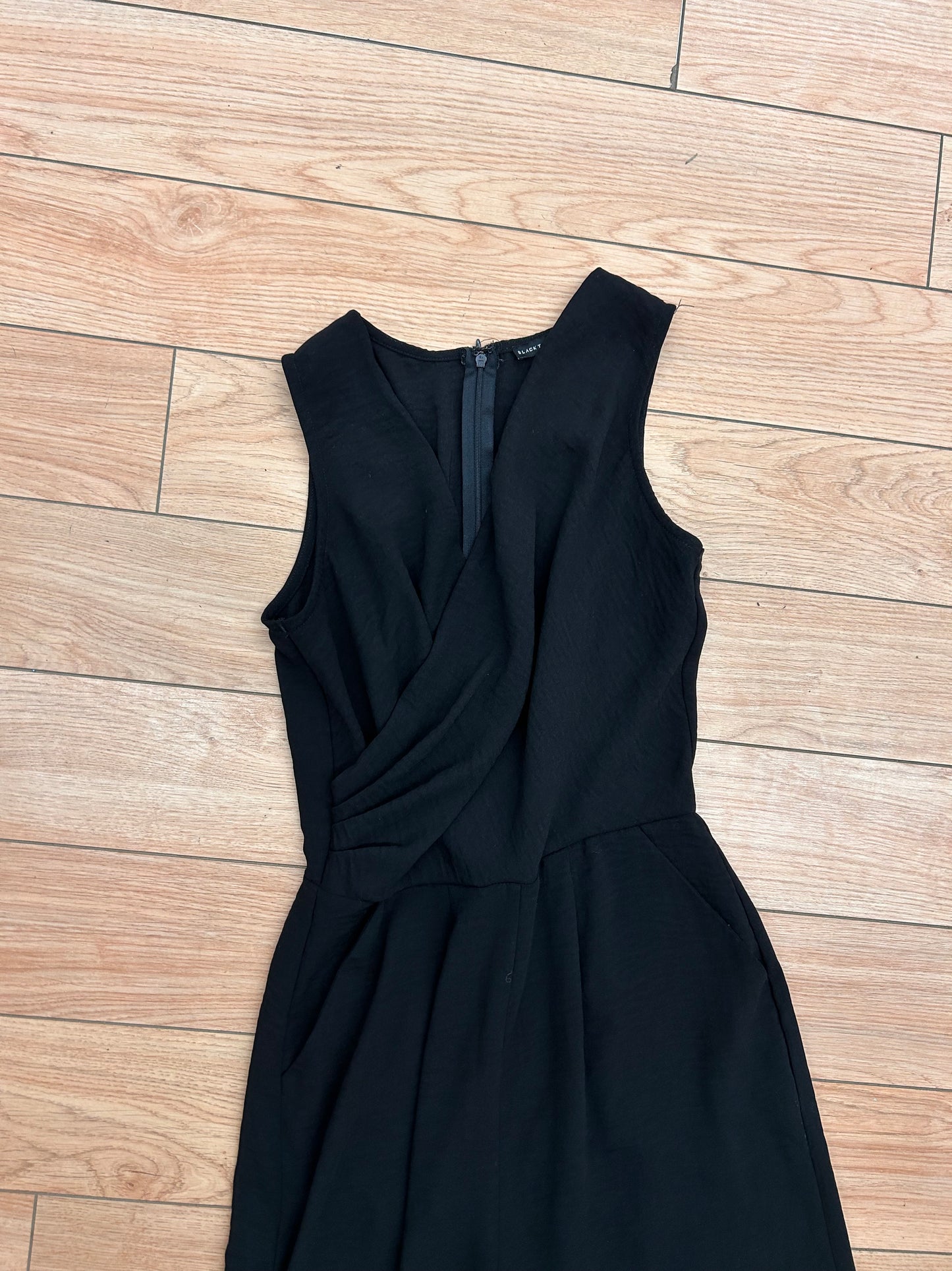 Black tape small black vneck sleeveless jumpsuit