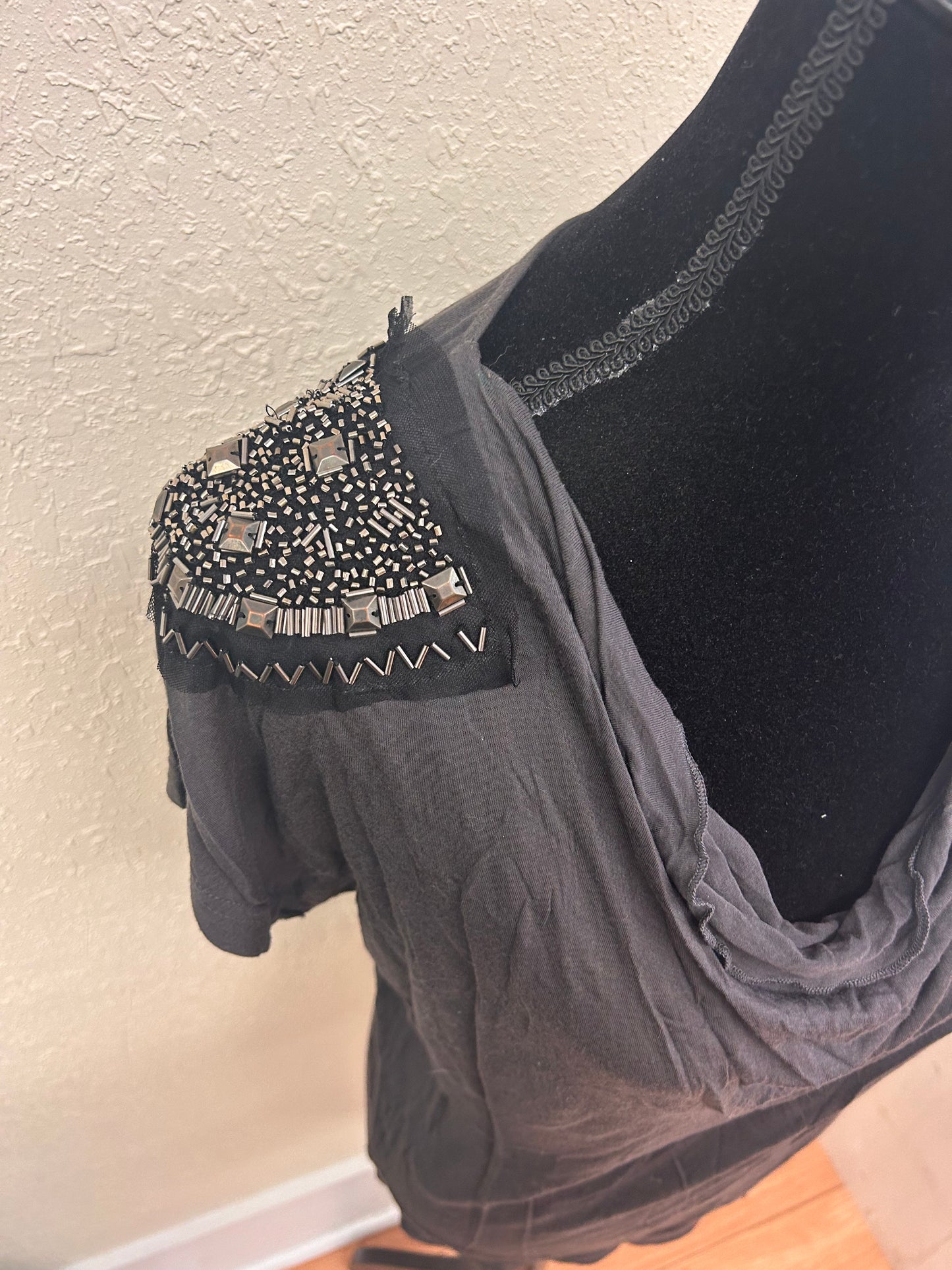 Only large studded shoulder blouse