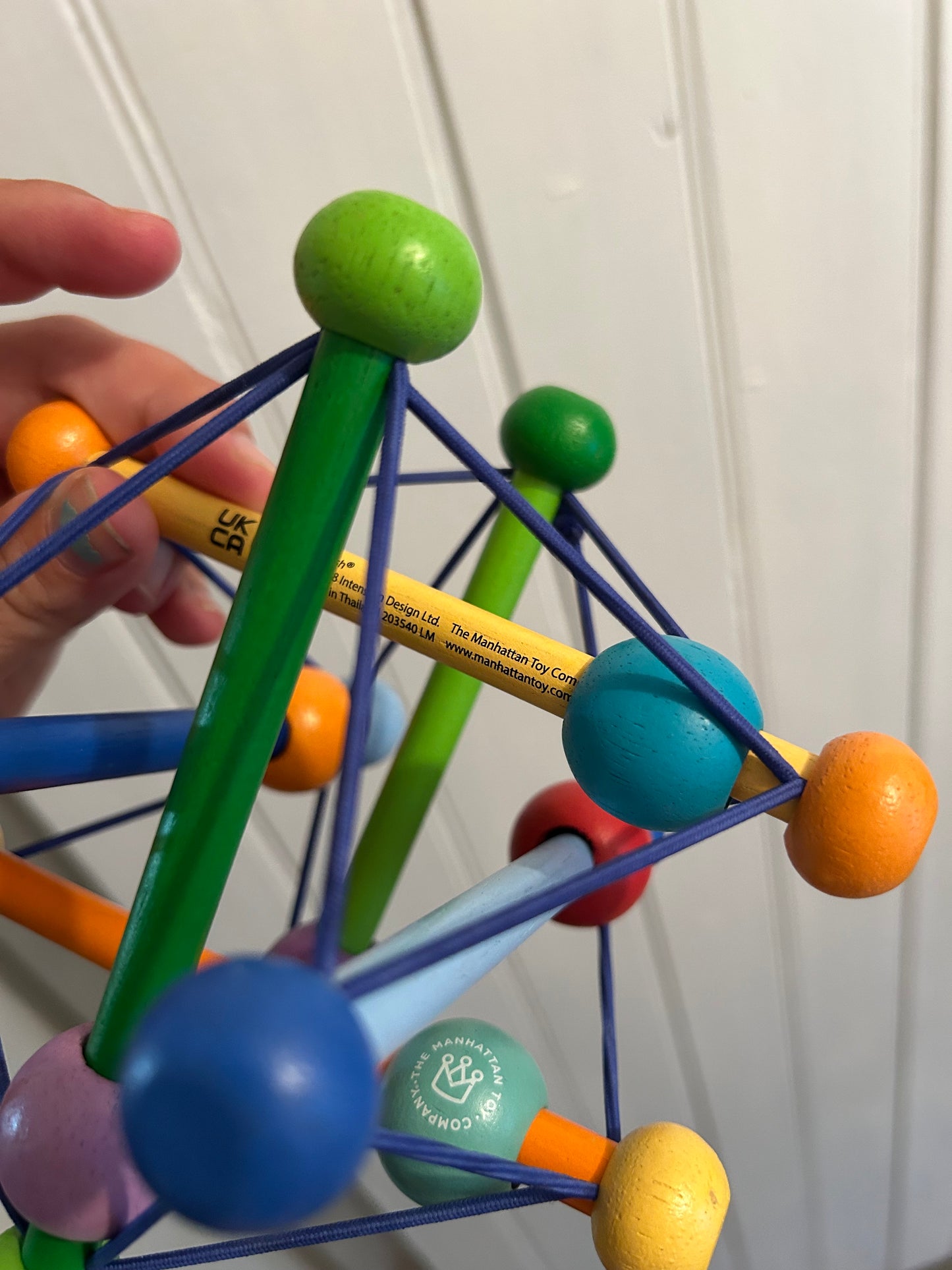 Manhattan toys wooden bead rattle toy