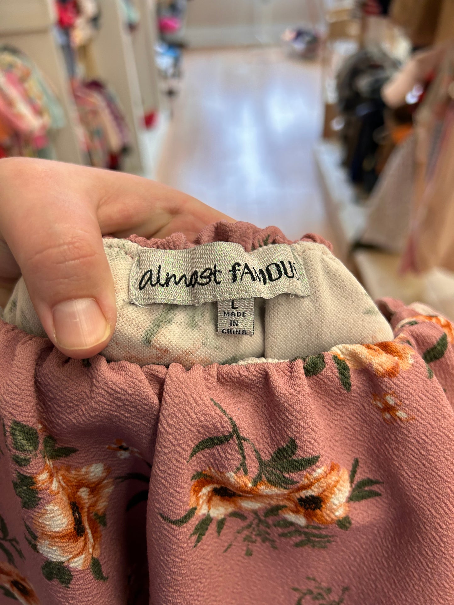 Almost famous large pink floral romper