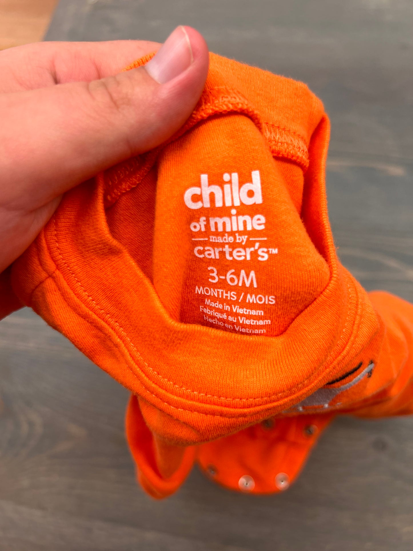 Carters 3/6m orange on the move onesie