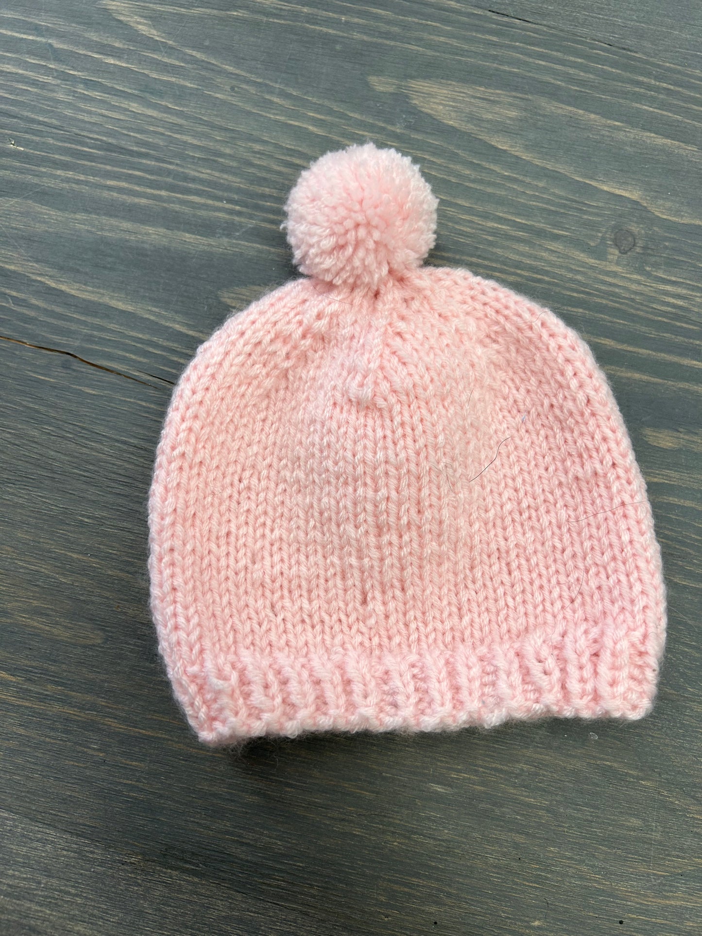 Handmade knit infant hats