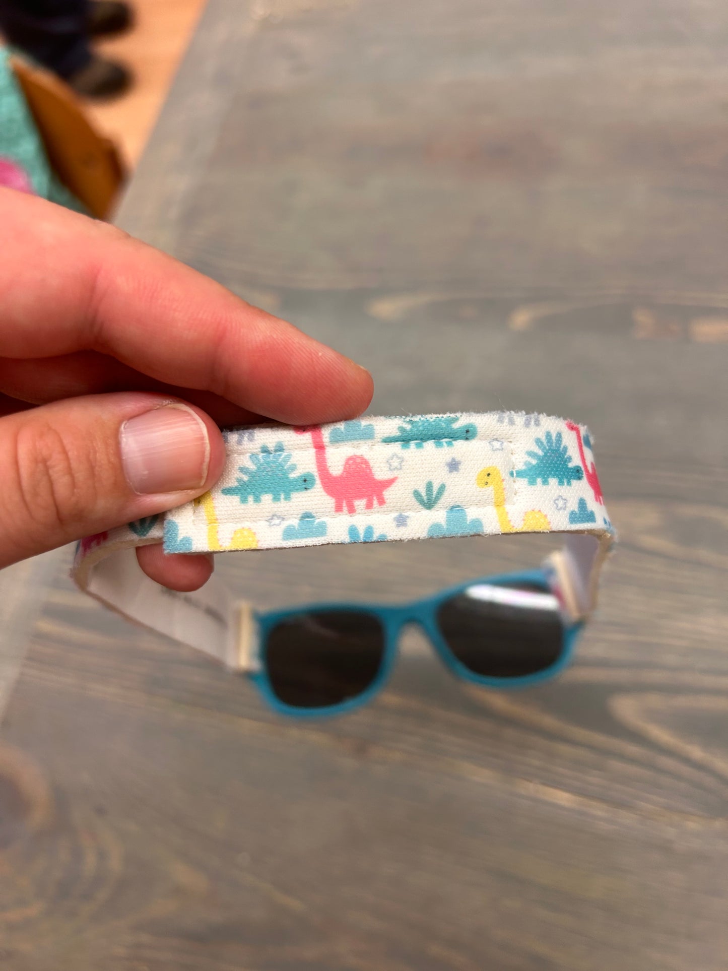 Infant blue sunnies with Dino strap